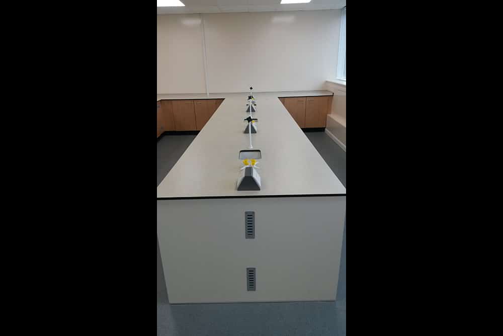 Science laboratory furniture island unit with pear door fronts
