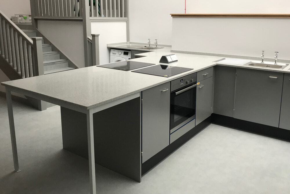 food technology room peninsula with integral seating space