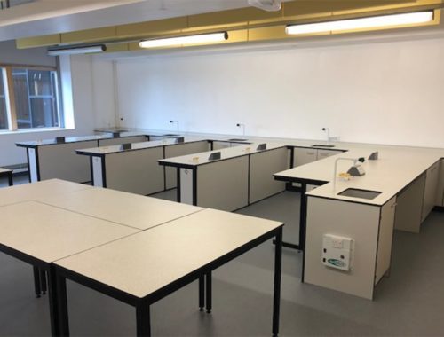 Loose tables arranged centrally in third lab