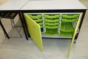 Science laboratory green storage unit with trays.