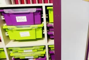 Storage room for secondary school with green and purple Gratnells’ Trays