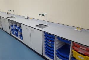 Science lab back benching storage with tray storage.
