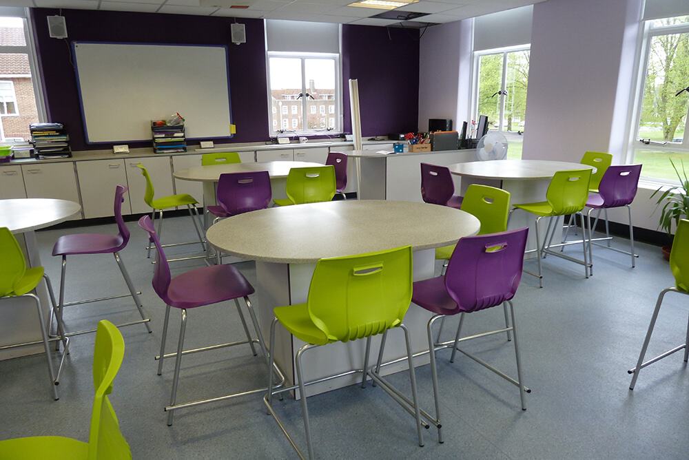 Science laboratory furniture with purple and green chairs