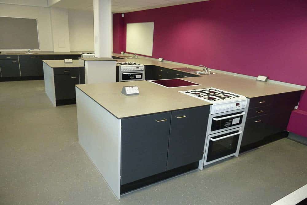 Southfield School food technology classroom with burgundy contrast wall.