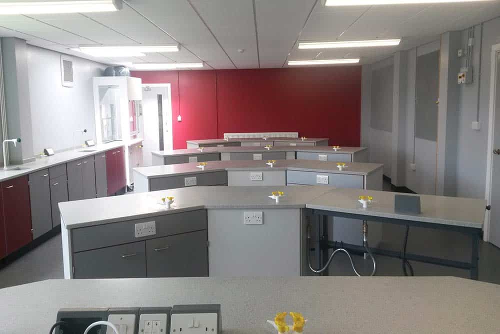 Poynton High School science laboratory with red contrast wall.