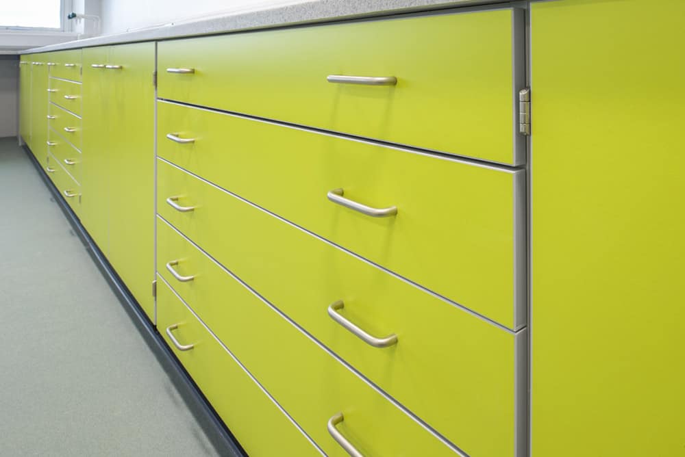 Callywith College benching with lime green storage draws.