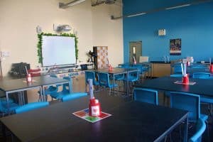 Co-op Academy Manchester school science laboratory with blue contrast wall.