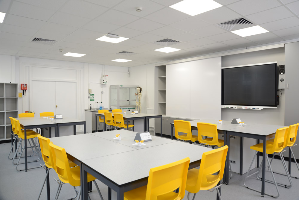The Royal Ballet School science lab features Trespa tables and yellow stools