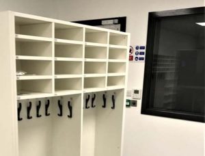 Numbered hooks and clean gown storage for clean room