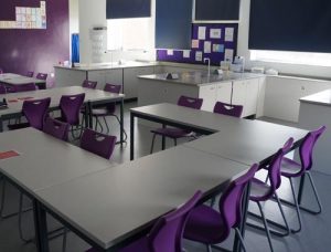Chemistry lab theory area with co-ordinating purple chairs