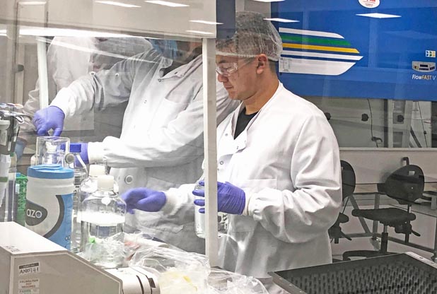 laboratory fit out with scientist working in fume cupboard