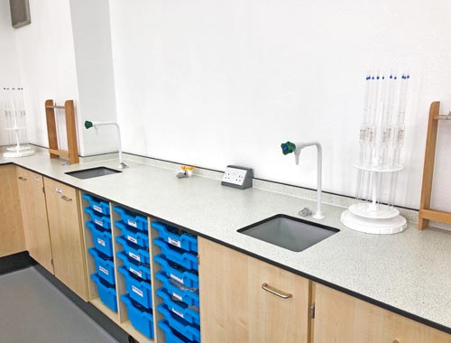 refurbishment of science lab showing perimeter benching and blue trays