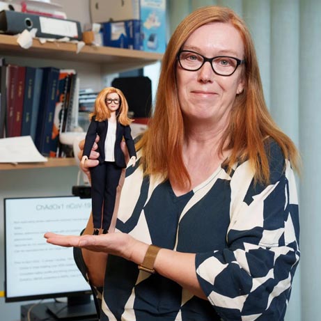 scientist professor dame sarah gilbert shown with her barbie doll
