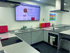 Workstation design for food technology classroom showing tv screen
