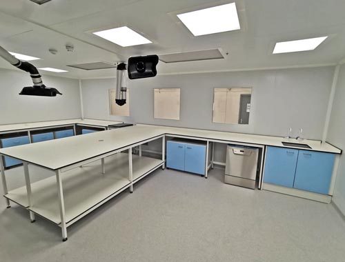 klick laboratories installation of lab furniture with contrast light blue doors